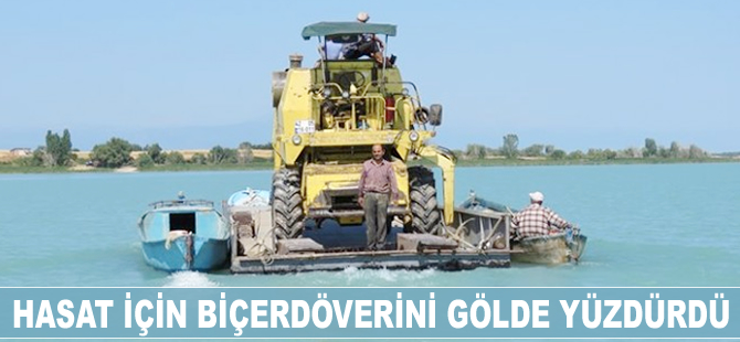 Hasat için biçerdöverini gölde yüzdürdü