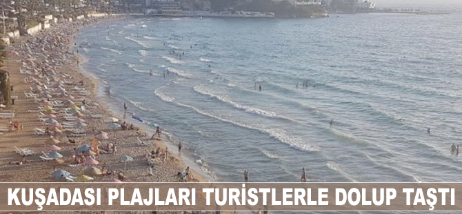 Kuşadası plajlarını turistler doldurdu