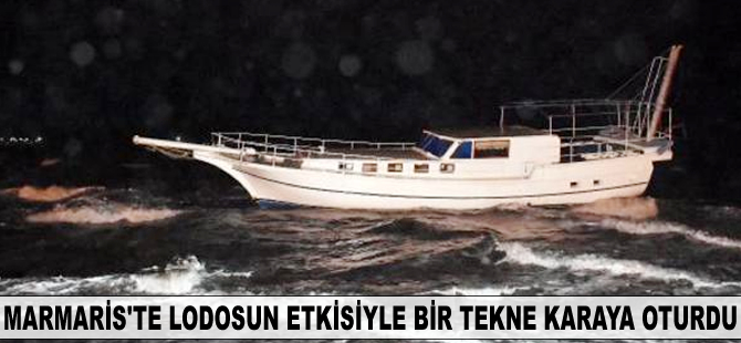 Marmaris'te lodosun etkisiyle bir tekne karaya oturdu