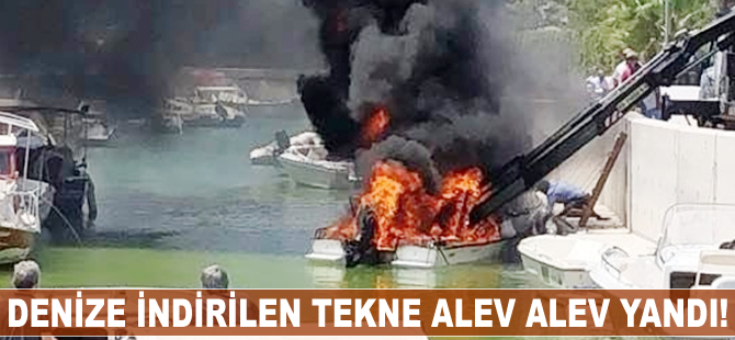 Denize indirilen tekne alev alev yandı