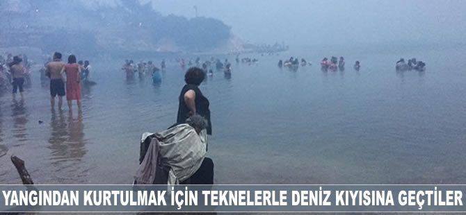 Yangından kurtulmak için teknelerle deniz kıyısına geçtiler
