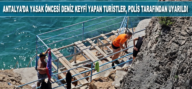 Antalya’da kayalık alanda deniz keyfi yapmak isteyen çoğunluğu turist 7 kişi, polis tarafından uyarıldı