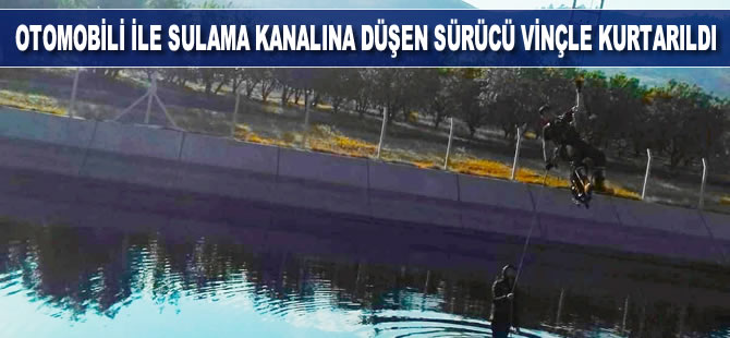 Otomobili ile sulama kanalına düşen sürücü vinçle kurtarıldı