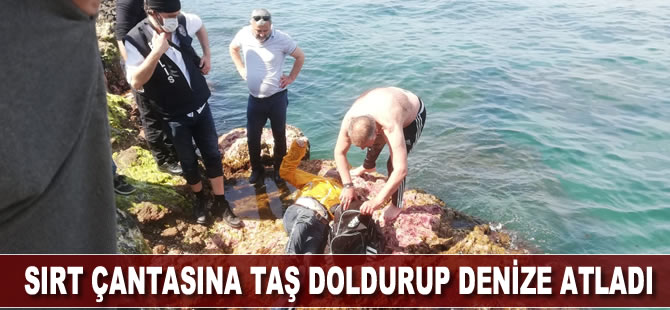 Sırt çantasına taş doldurup denize atladı