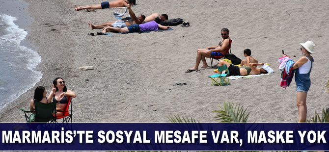 Marmaris plajlarında sosyal mesafe var, maske yok