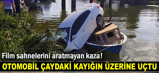 Otomobil, çaydaki kayığın üzerine uçtu