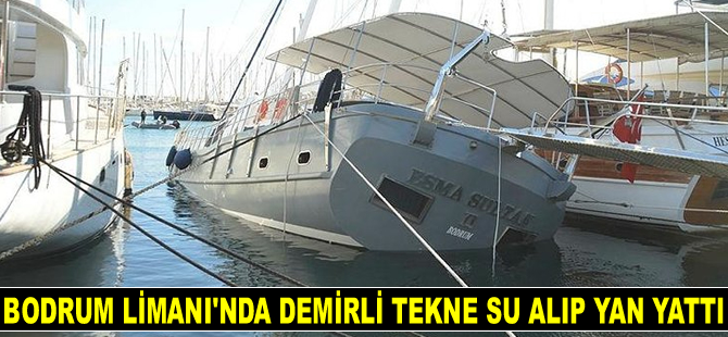 Bodrum Limanı'nda demirli tekne su alıp yan yattı