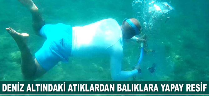 Deniz altındaki atıklardan balıklara yapay resif yaptı