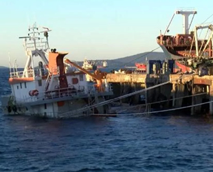 Kartal'da batan ve yan yatan gemiler, halatlarla iskeleye bağlandı