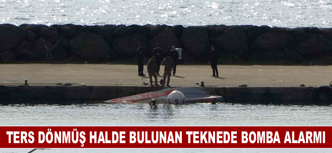 Ters dönmüş halde bulunan teknede bomba alarmı