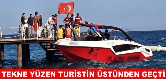 Deniz paraşütü teknesi yüzen turistin üstünden geçti