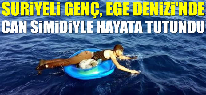 Suriyeli genç, Ege Denizi'nde can simidiyle hayata tutundu!
