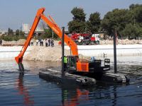 YÜTEK, İZSU’ya amfibi iş makinesini teslim etti